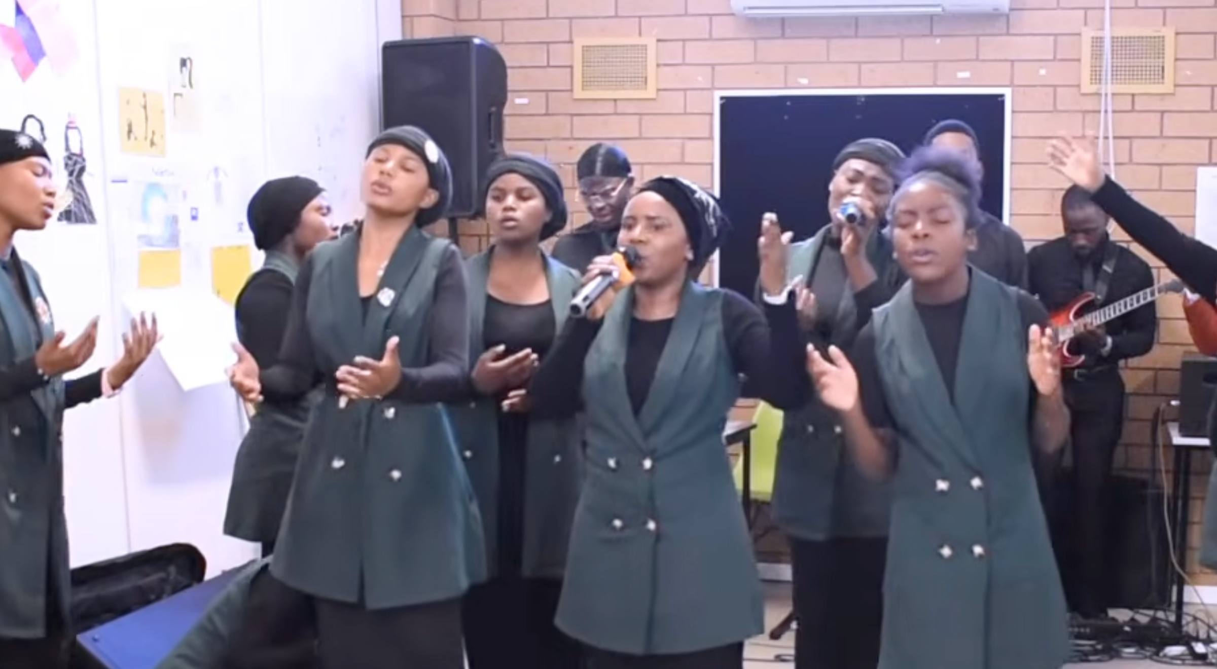 Voices and hands lifted in praise.